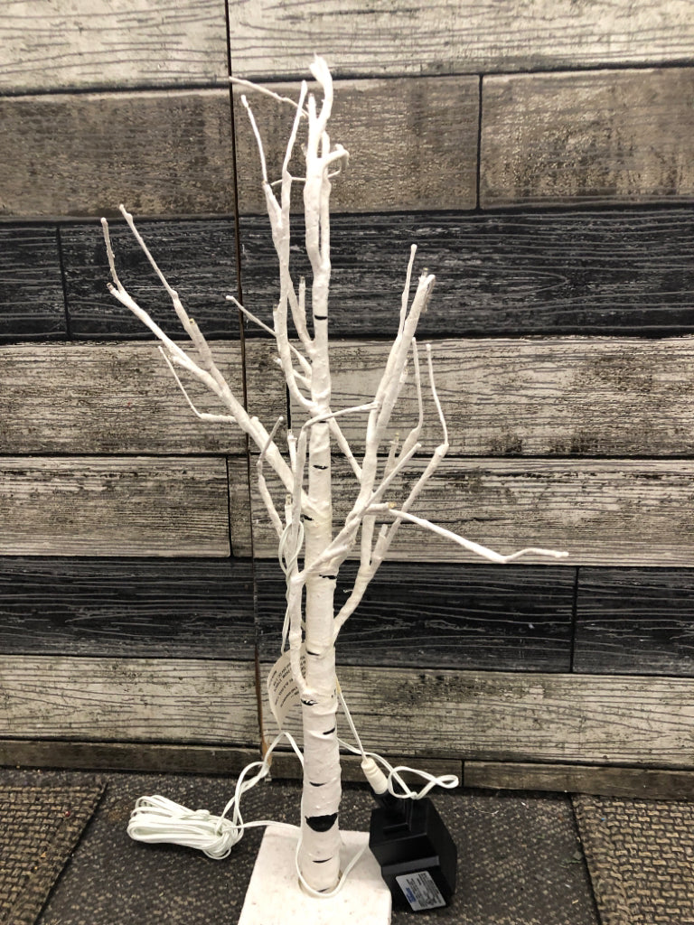 WHITE & BLACK DISTRESS LIGHT UP TREE ON WHITE BASE.