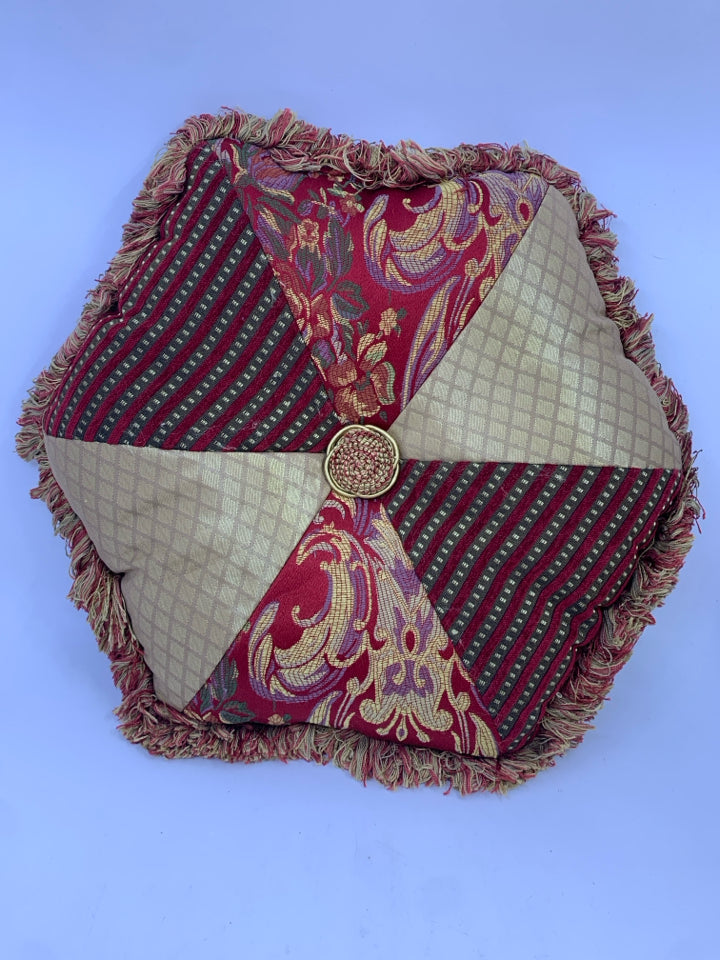 GOLD/RED HEXAGON PILLOW WITH FRINGE.