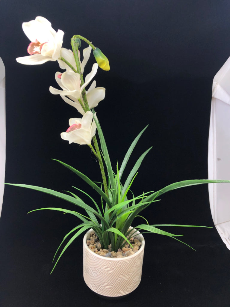 FAUX ORCHID IN TEXTURED CERAMIC PLANTER.