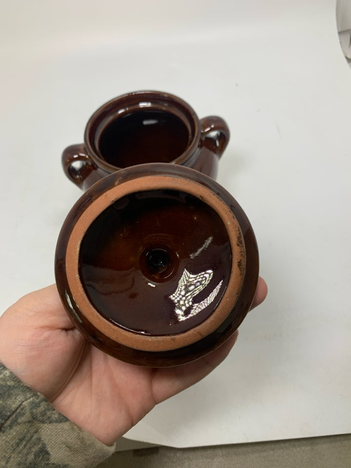 TWO TONED PAINTED BULL HEADED DOUBLE HANDLED CROCK.