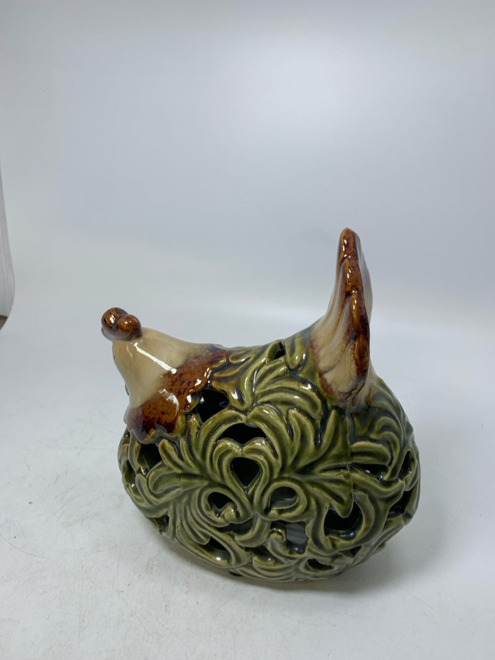 GREEN PIERCED SITTING HEN.