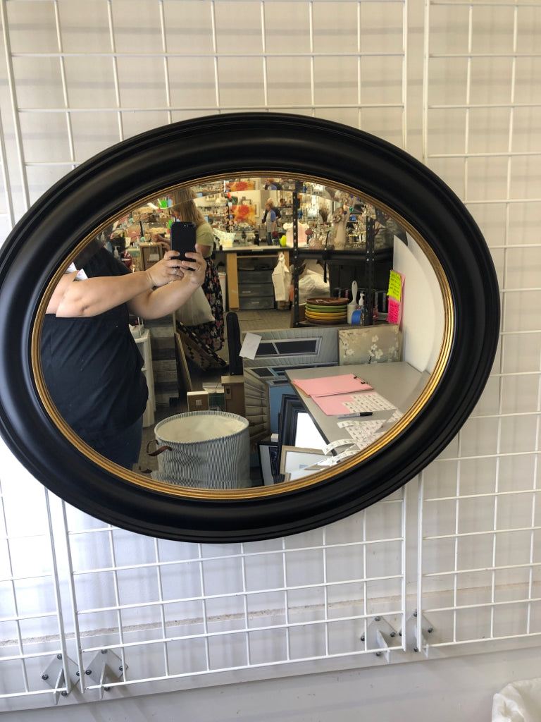 BLACK OVAL MIRROR W/ GOLD EDGE.