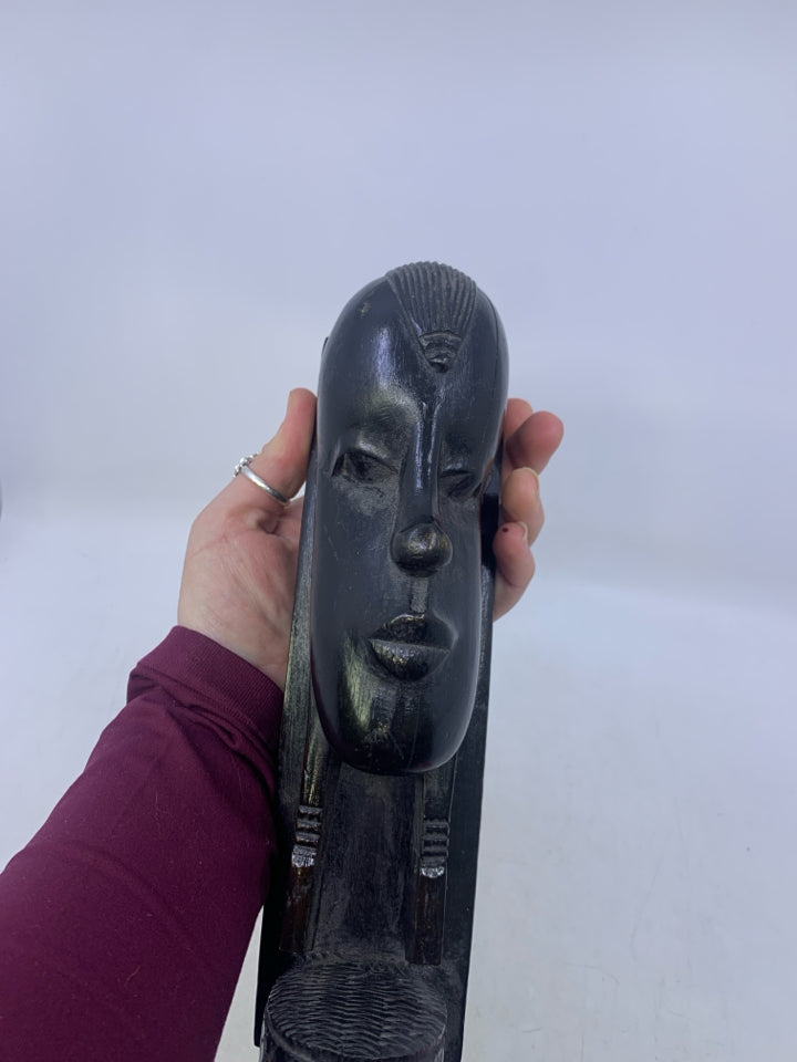 HEAVY BLACK WOOD CARVED FACE W/ FLAT EDGE FOLK AR BOOK END.