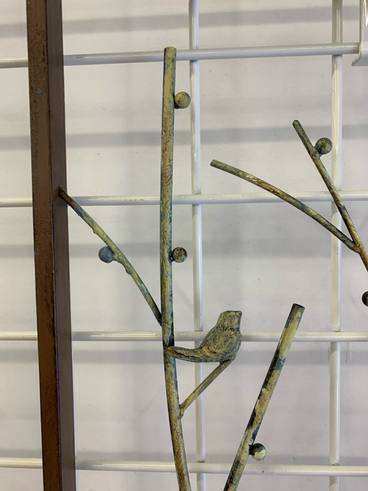 BIRDS ON BRANCHES METAL WALL HANGING W/DISTRESSED YELLOW PAINT.