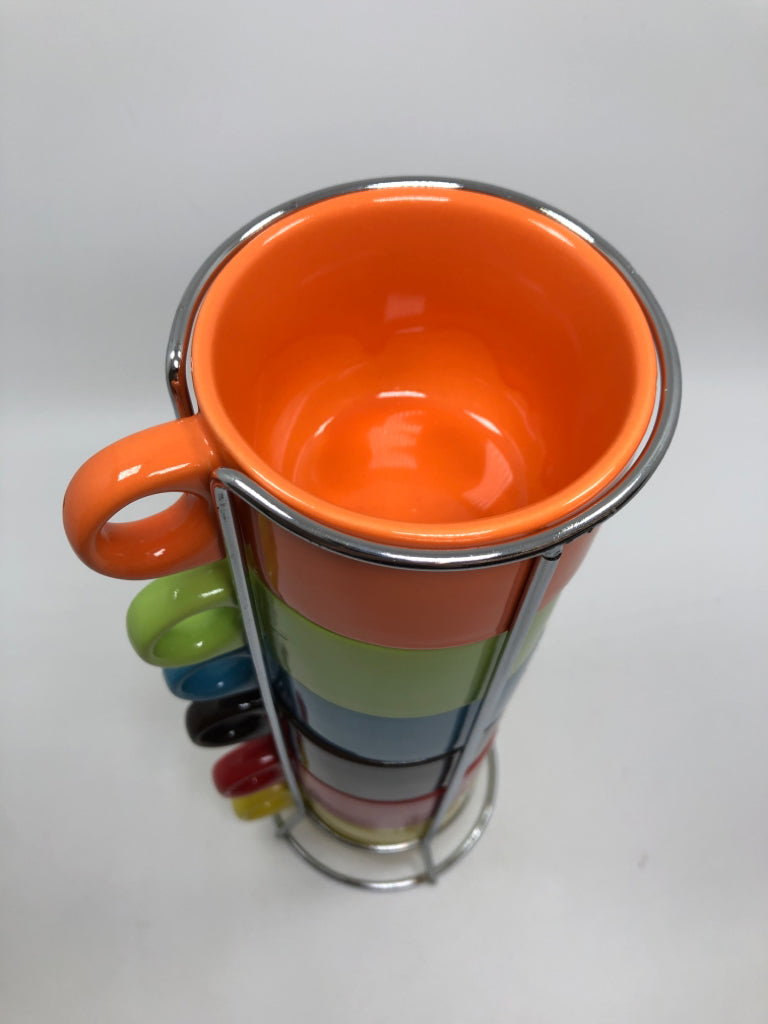 6 MULTI COLOR PIER 1 MUGS IN STAND.