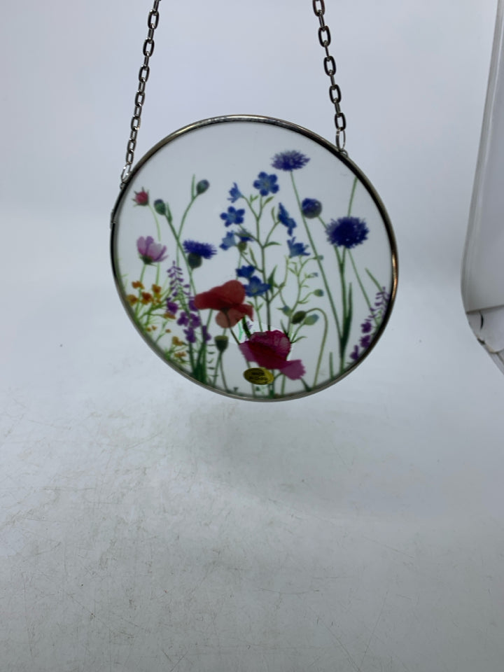 SMALL CIRCLE FROSTED GLASS W/ PRINTED COLORFUL FLOWERS.