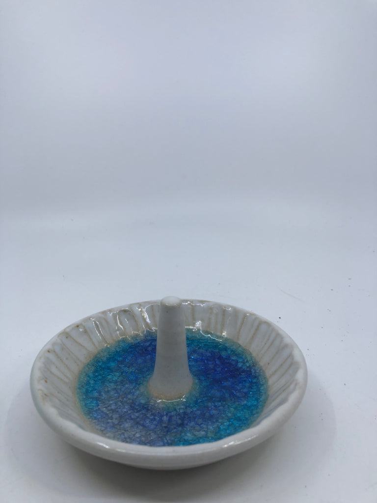 WHITE CLAY BOWL WITH BLUE SPECKLED BOTTOM RING HOLDER.