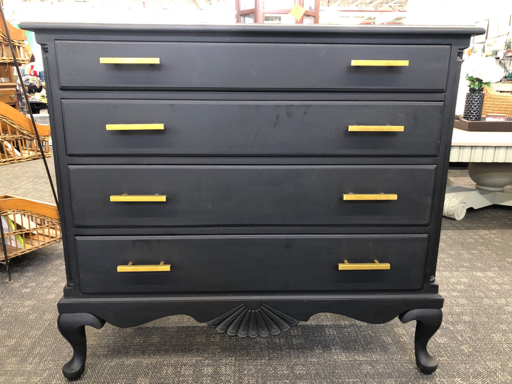 4-DRAWER BLACK DRESSER W/GOLD HANDLES.