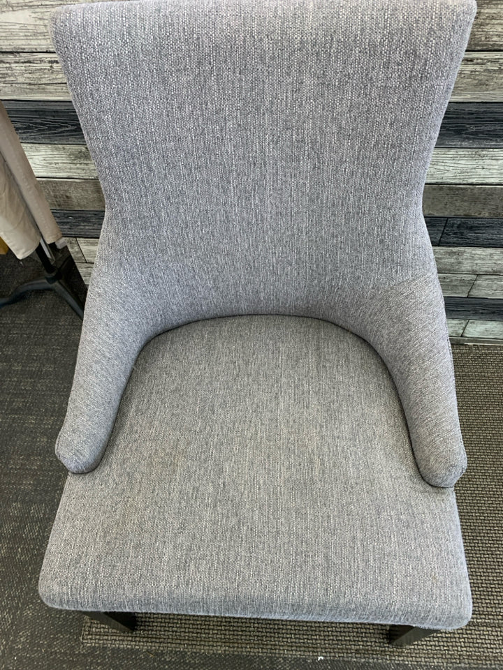 DARK GREY ACCENT CHAIR W/ BLACK LEGS STUDDED EDGE.