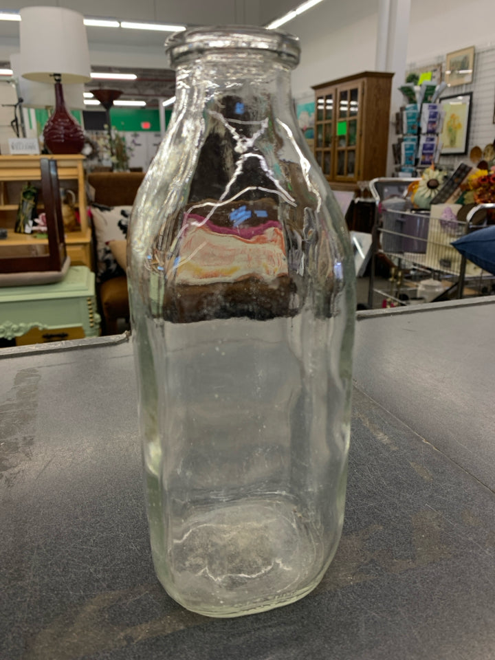 CLEAR MILK EMPTY BOTTLE.