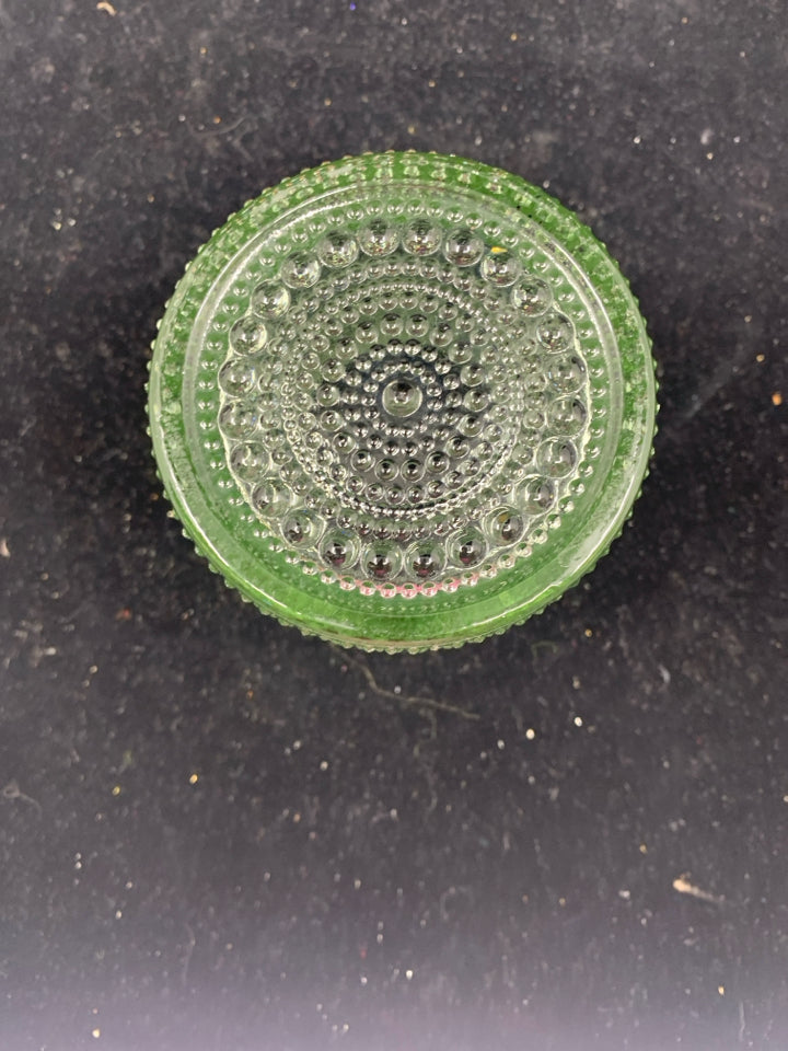 GREEN TINTED TEXTURED GLASS CANDLE HOLDER.