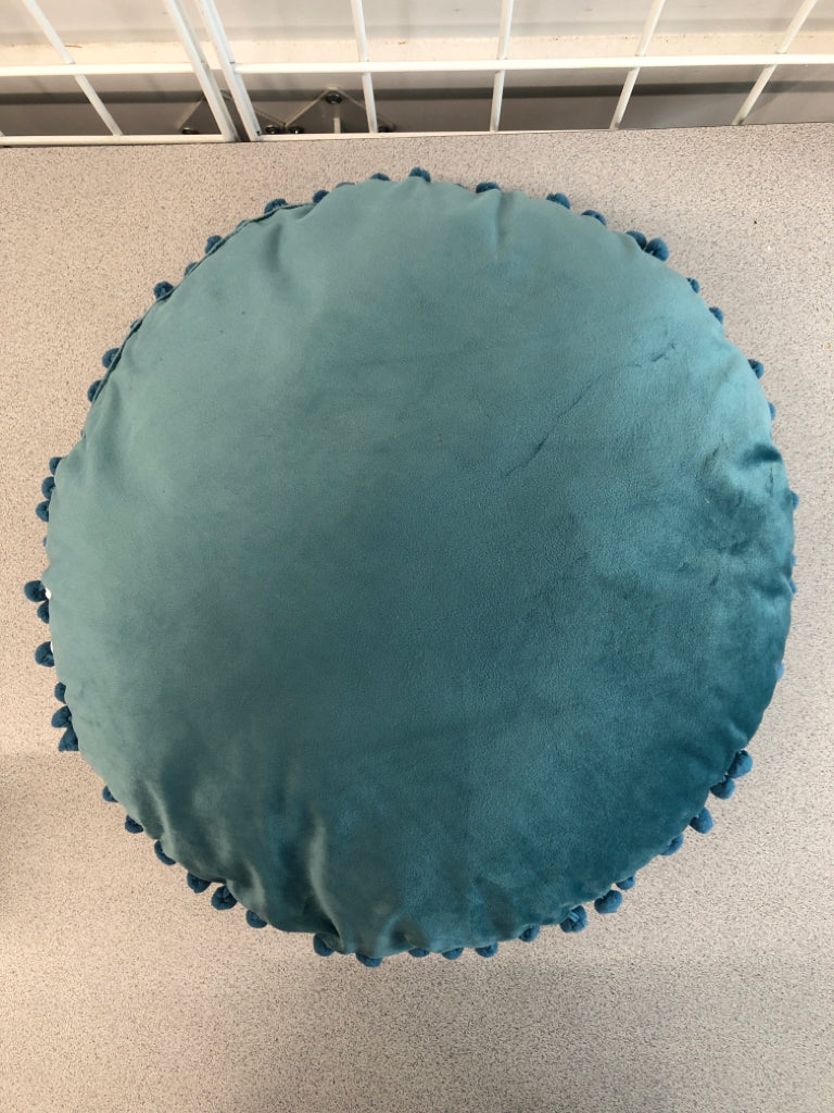 ROUND BLUE PILLOW W/POM POMS.