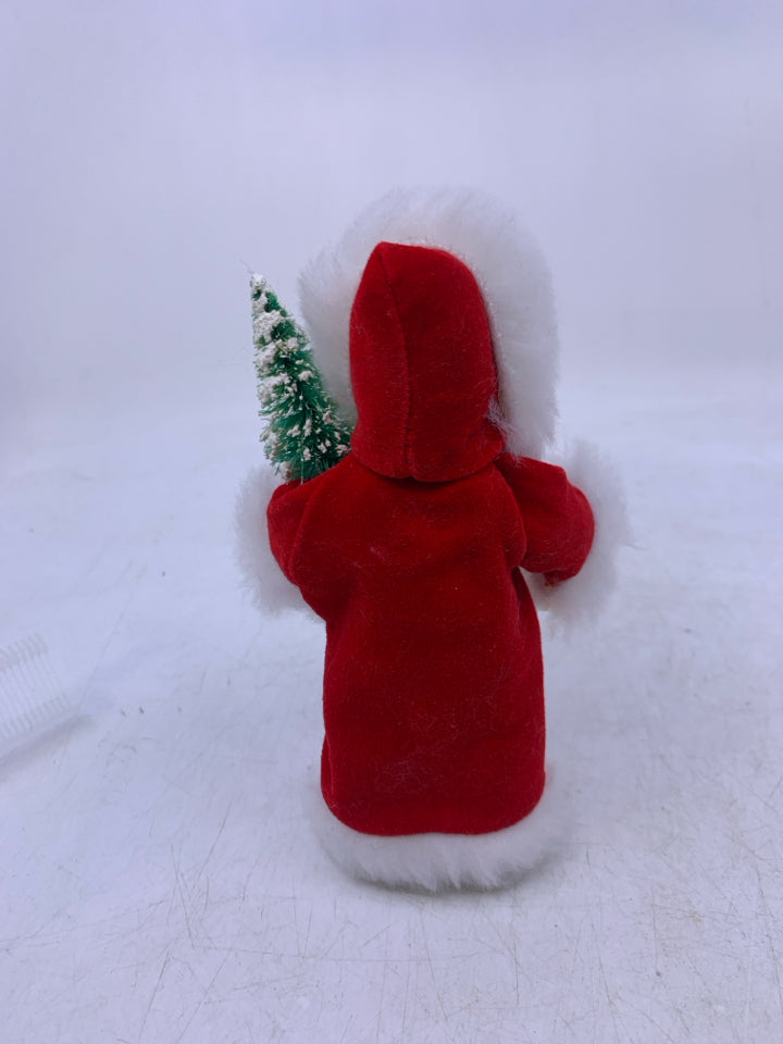 KID HOLDING CHRISTMAS TREE BYERS' CHOICE 1992.