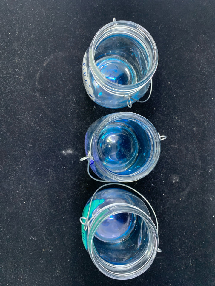 3 BLUE TEA LIGHT HOLDERS.