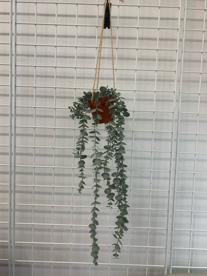 FAUX EUCALYPTUS IN HANGING PLASTIC POT.