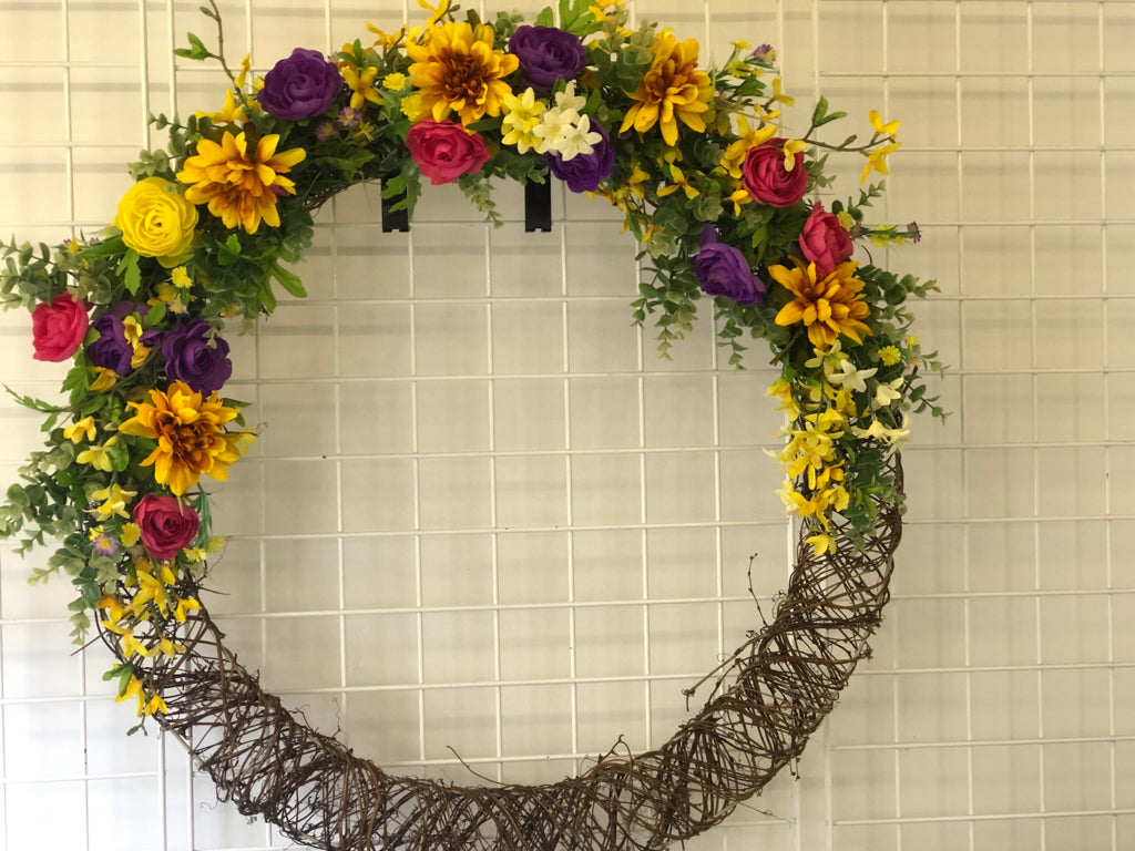 LARGE PINK YELLOW PURPLE FAUX FLORAL WREATH.