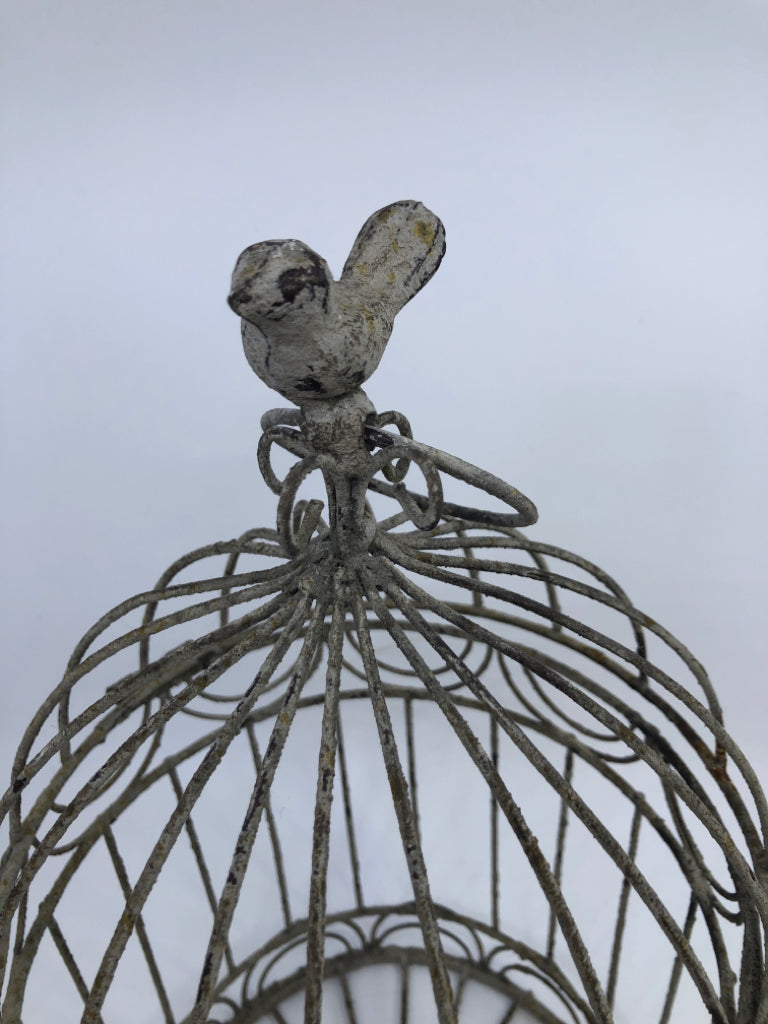 DISTRESSED METAL BIRD CAGE W/ BIRD ON TOP.