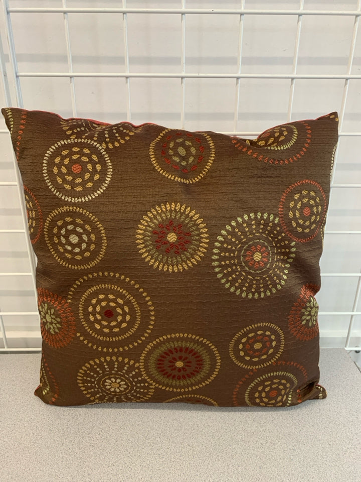RED/BROWN CIRCLE STITCHED PILLOW.