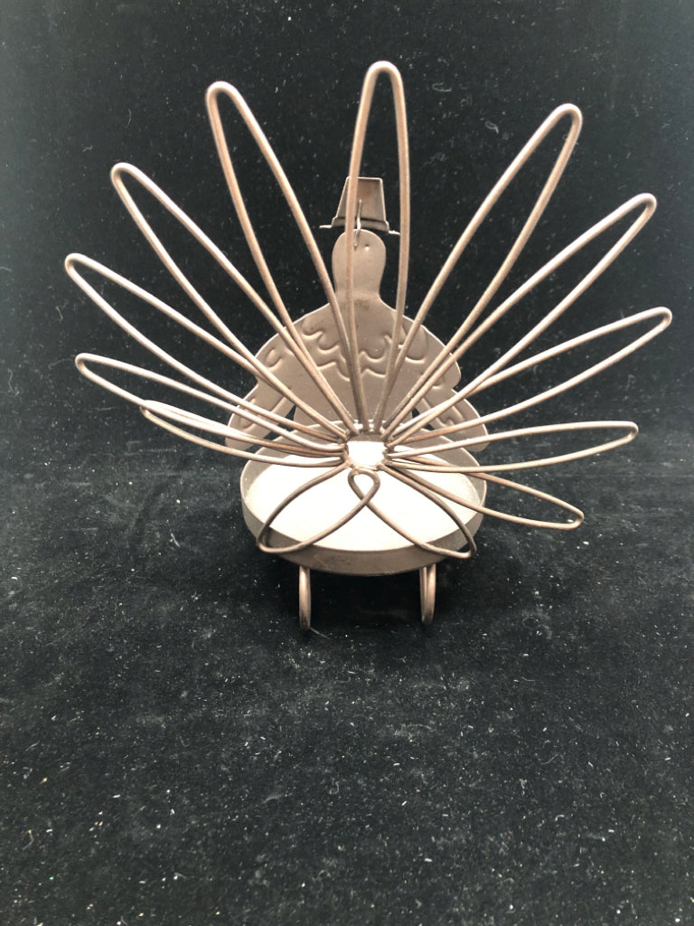 BROWN METAL TURKEY CANDLE HOLDER.