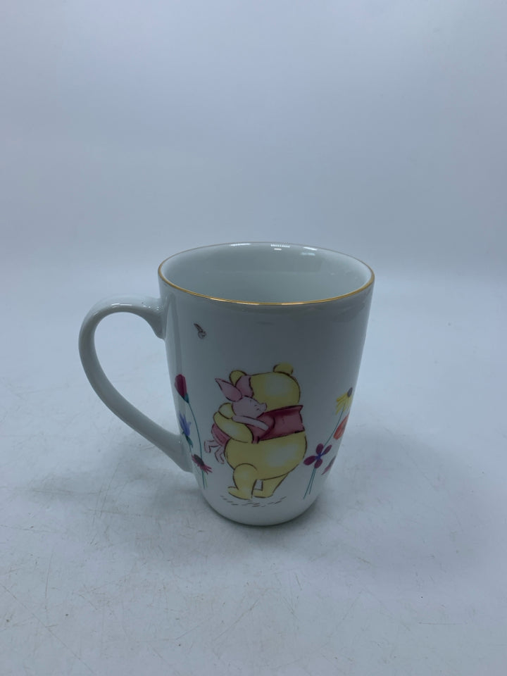 WINNIE THE POOH HUGGING PIGLET FLORAL MUG.