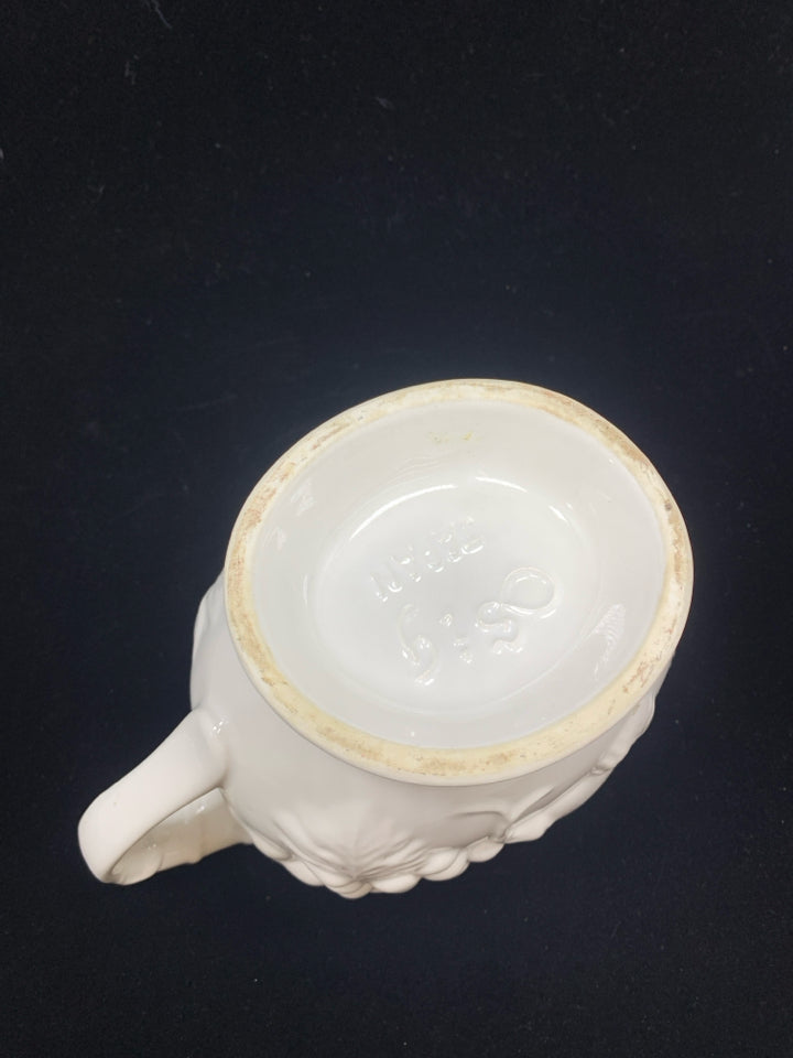 WHITE CERAMIC GRAVY BOAT W/EMBOSSED FRUIT.