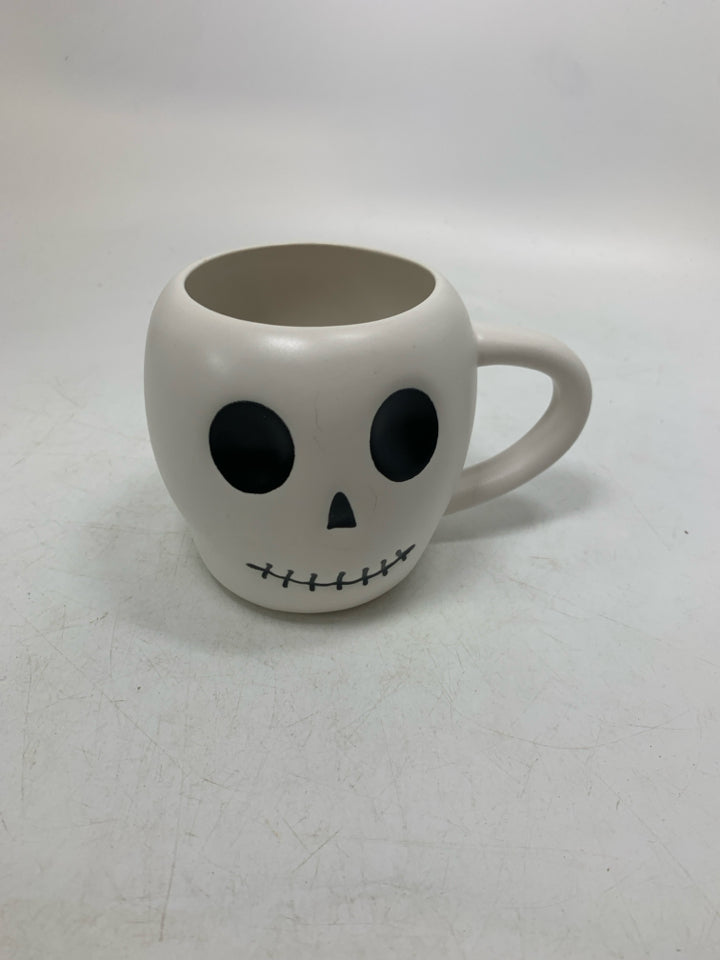 WHITE SKULL HEAD MUG.