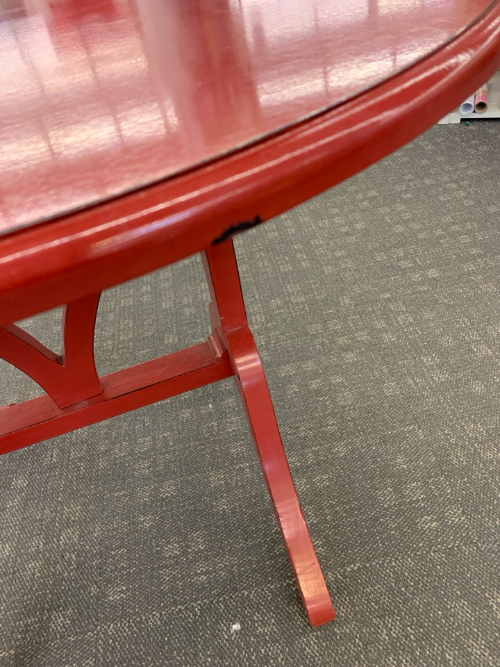 OVAL RED FLIP TOP TABLE.