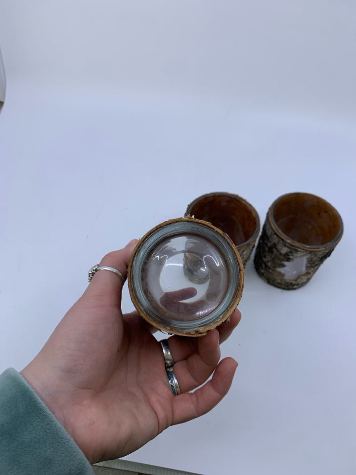 3 TREE BARK COVERED TEA LIGHT HOLDERS W/ TREE CUTOUT.