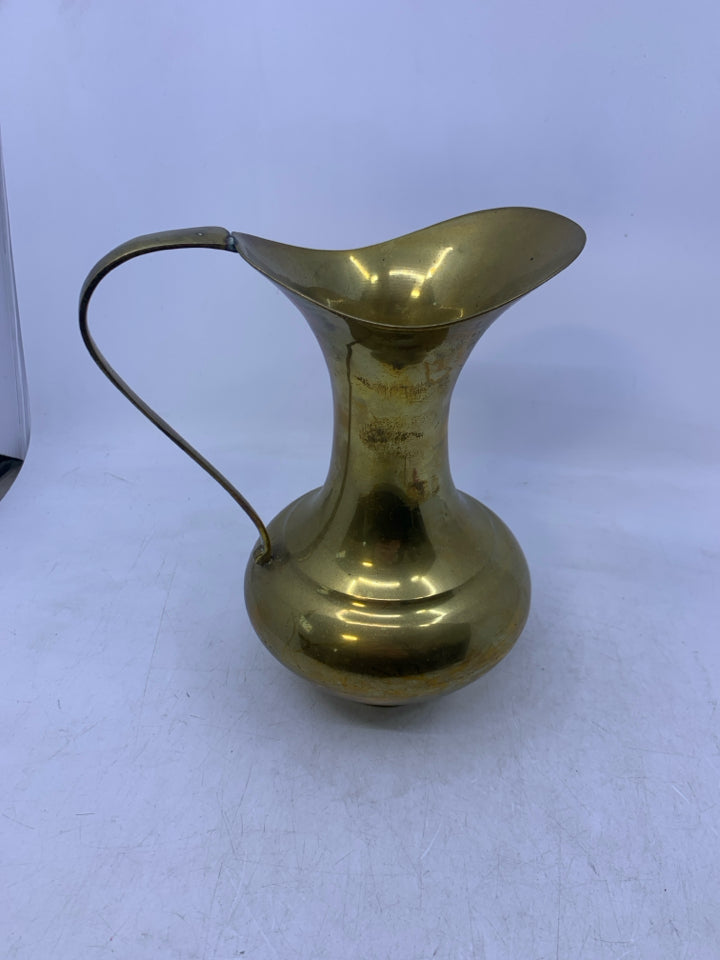 BRASS FOOTED PITCHER.
