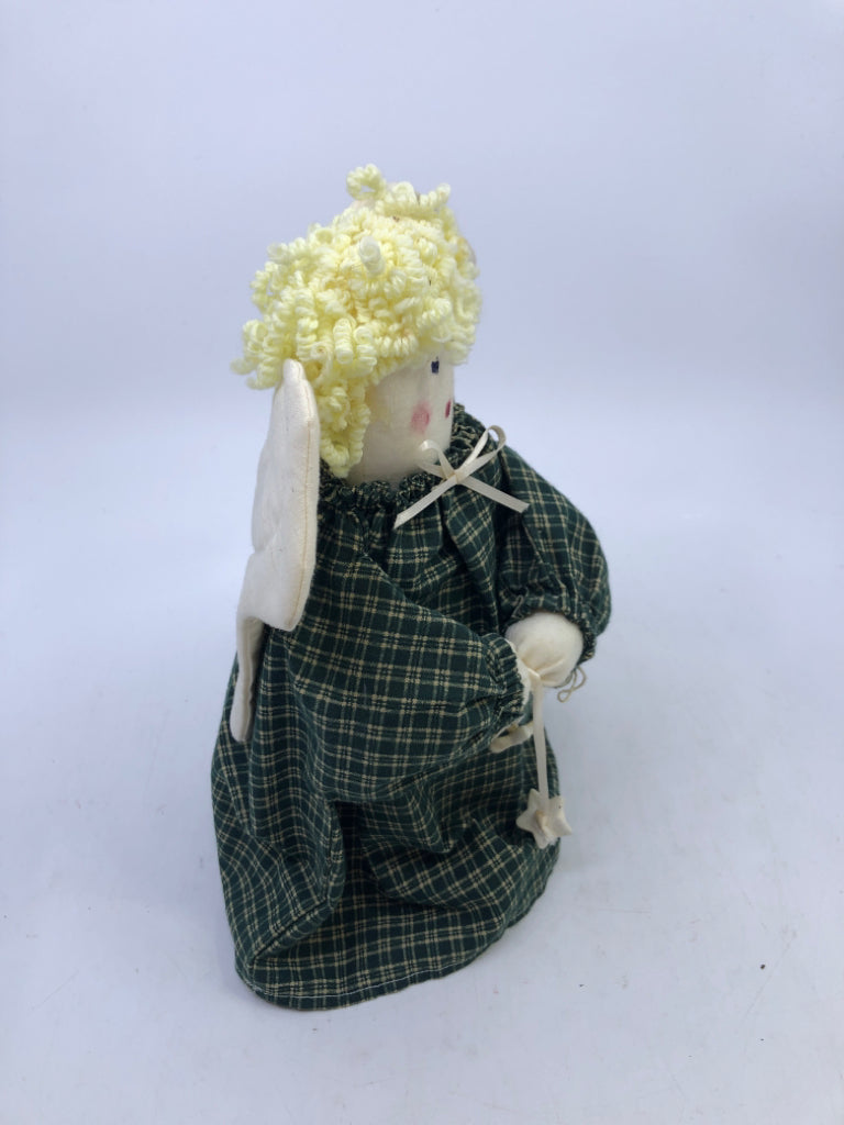 SOFT WHITE ANGEL IN GREEN FLANNEL DRESS.