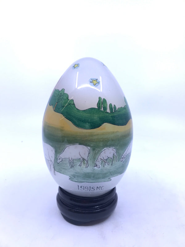 GLASS PAINTED EGG W/ STAND SHEPARD RELIGIOUS THEME IN BOX.