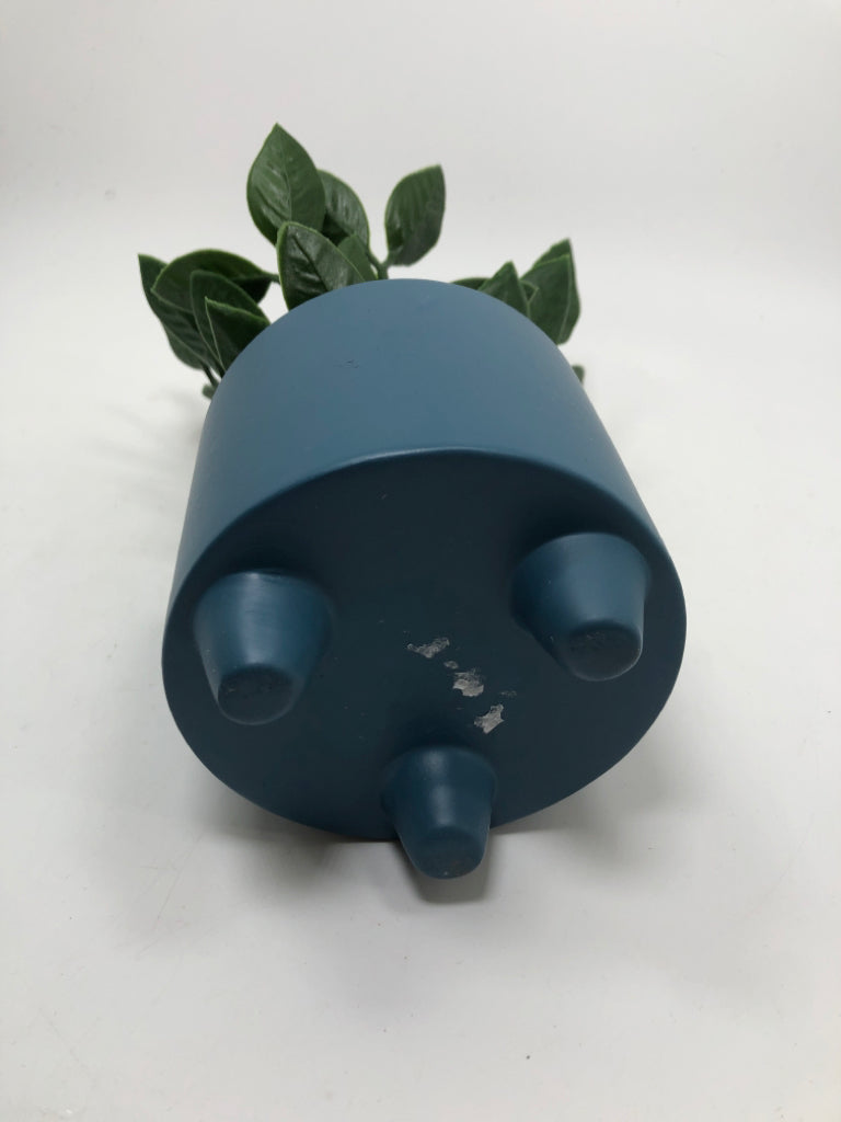 FAUX GREENERY IN BLUE PLANTER.