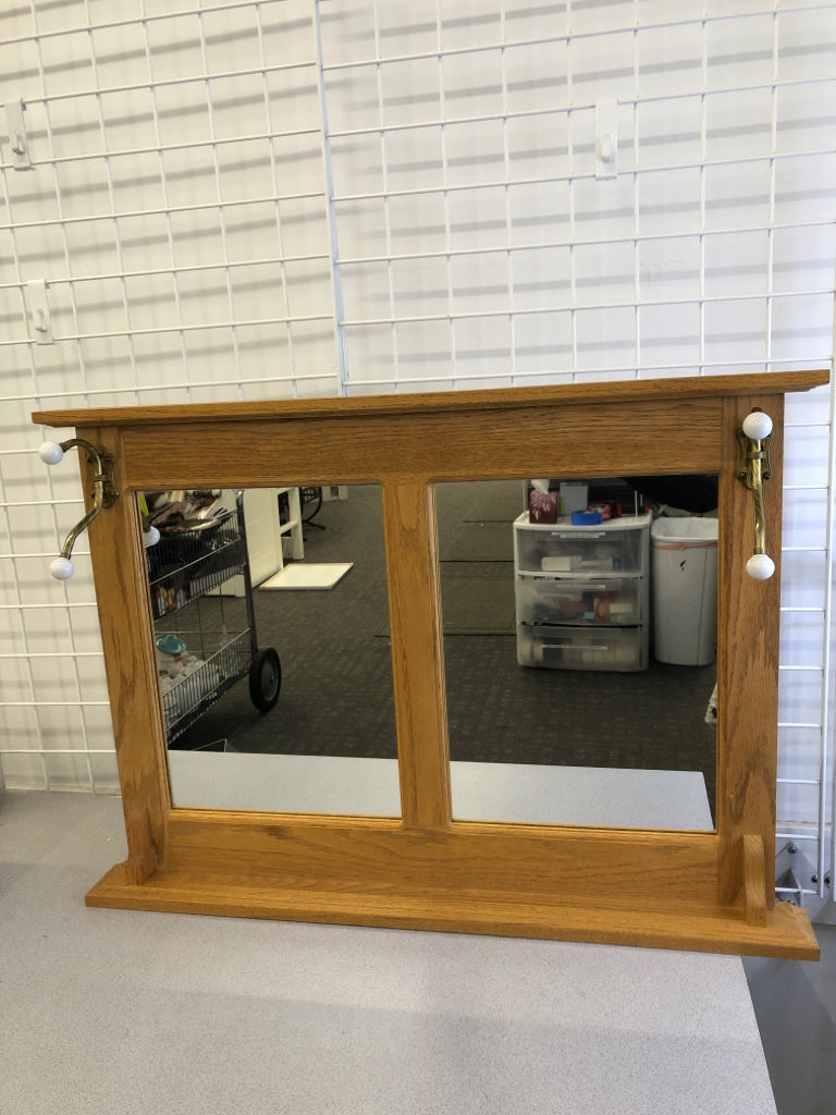 WALL MIRROR W/TWO COAT HOOKS.