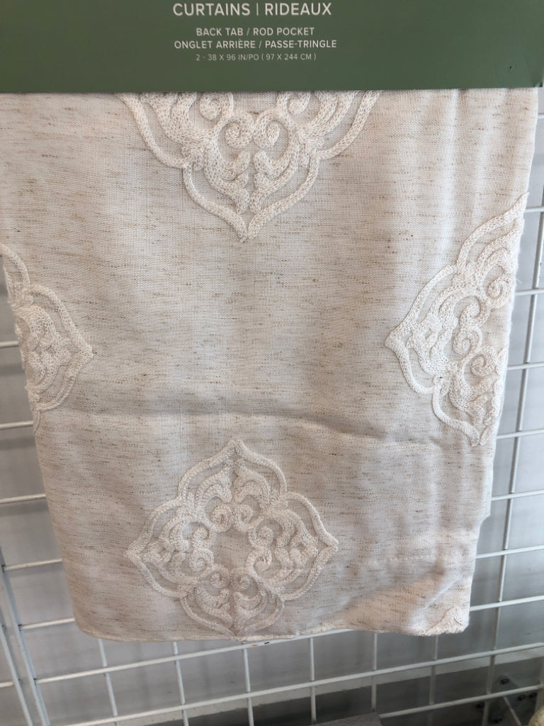 NIP 2PK CREAM BACK TAB CURTAINS.