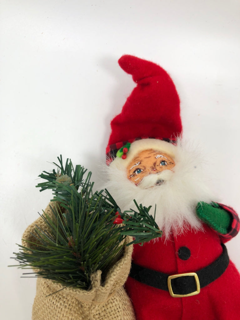 ANNALEE MINI SANTA IN ELF SHOES HOLDING CHRISTMAS SACK.