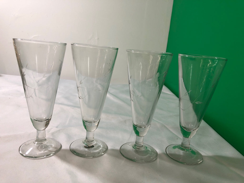 4 ETCHED  PILSNER GLASSES.