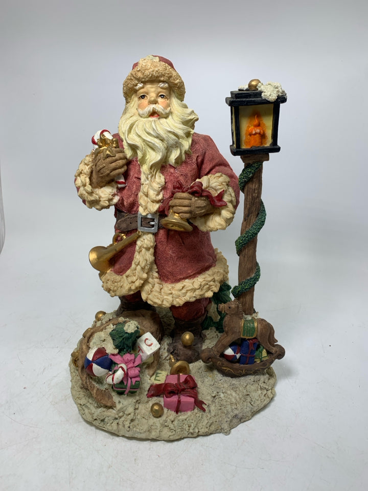 HEAVY RESIN SANTA W/ LAMP POST/ TOYS.