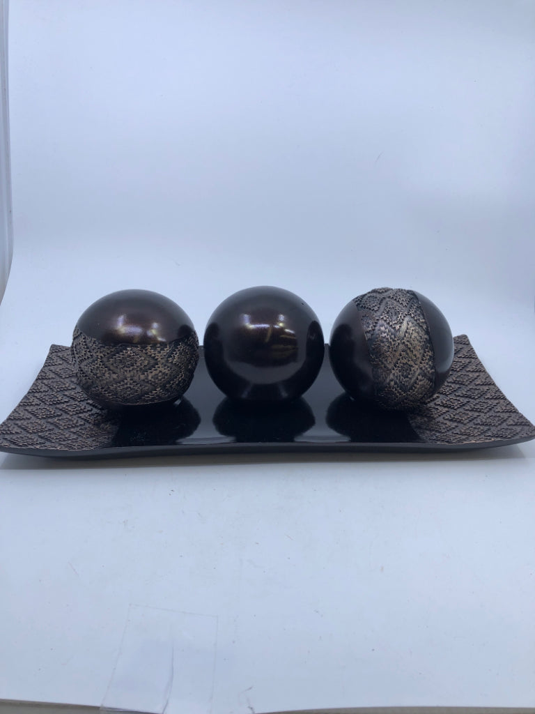 3 BROWN BALLS ON CENTERPIECE TRAY.