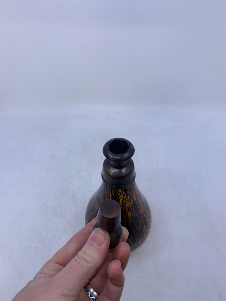 AMBER GLASS W/ LARGE BROWN SPOTS DECANTER W/ METAL STOPPER.