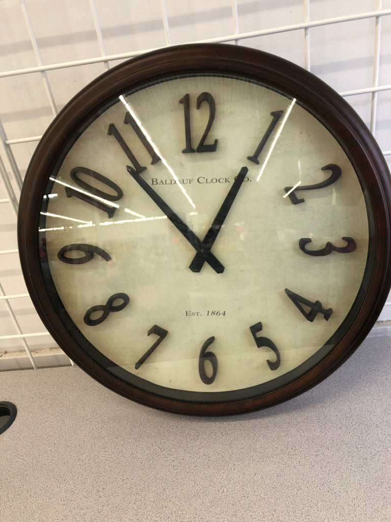 BRONZE PLASTIC WALL CLOCK.