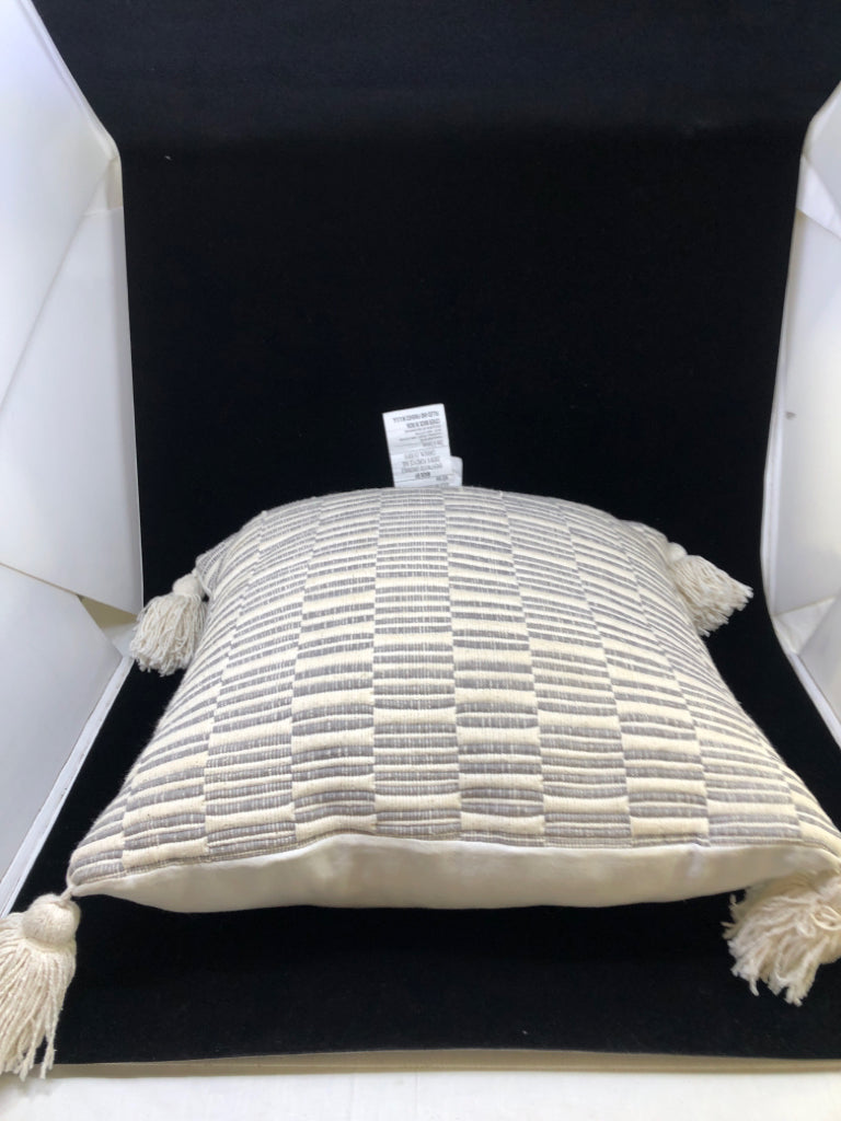 GREY STRIPE PILLOW W/CREAM TASSLES.
