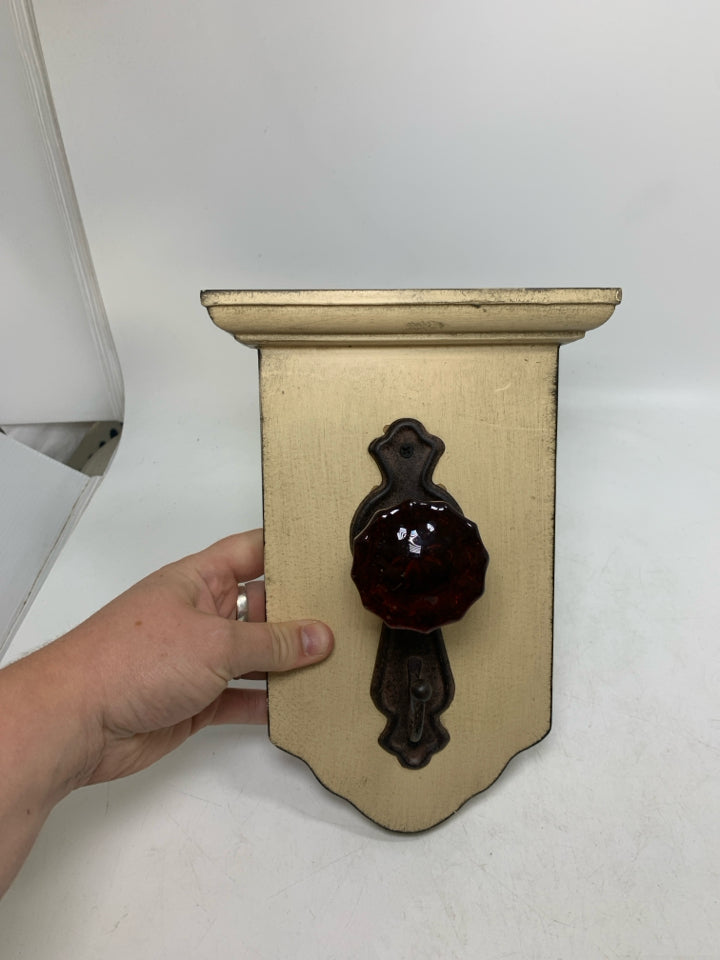 RUSTING DOOR KNOB HOOK WALL HANGING.