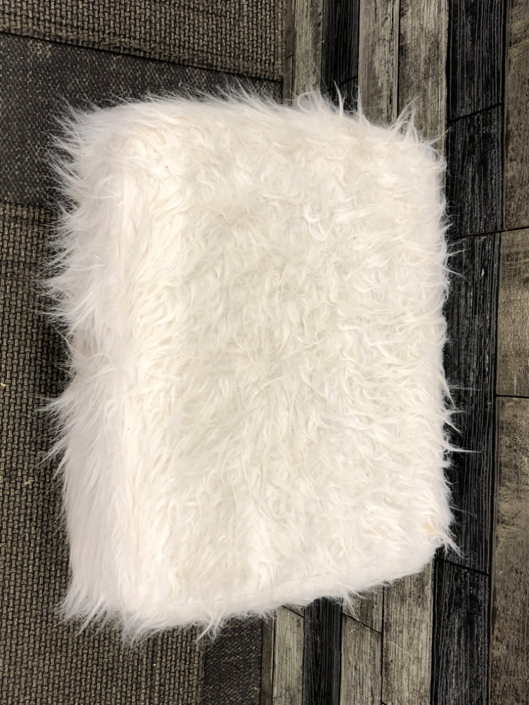 WHITE FURRY FOOTSTOOL W/GOLD LEGS.