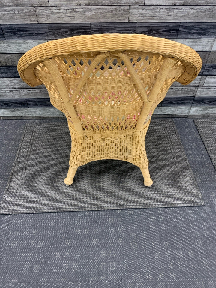 BLONDE WICKER CHAIR W/ PLAID CUSHION.