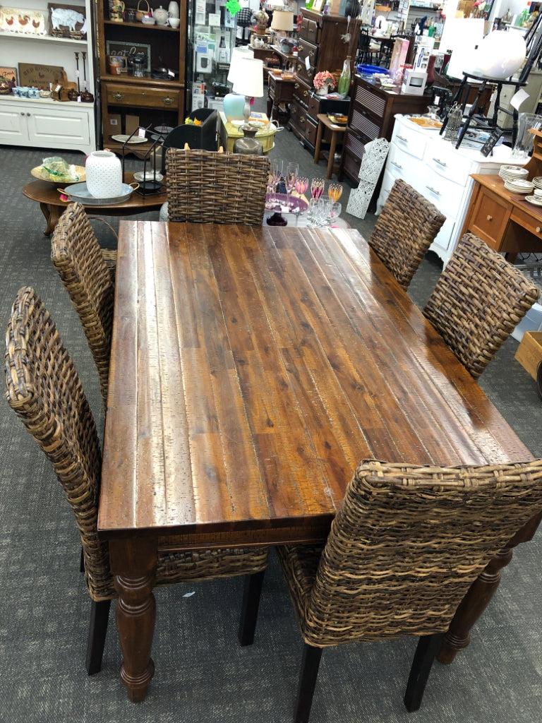 DARK WOOD STRESSED WOOD PATTERN TABLE W 6 WICKER WOVEN CHAIRS.