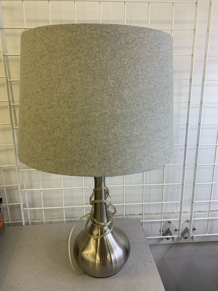SILVER BASE LAMP W/GREY SHADE.