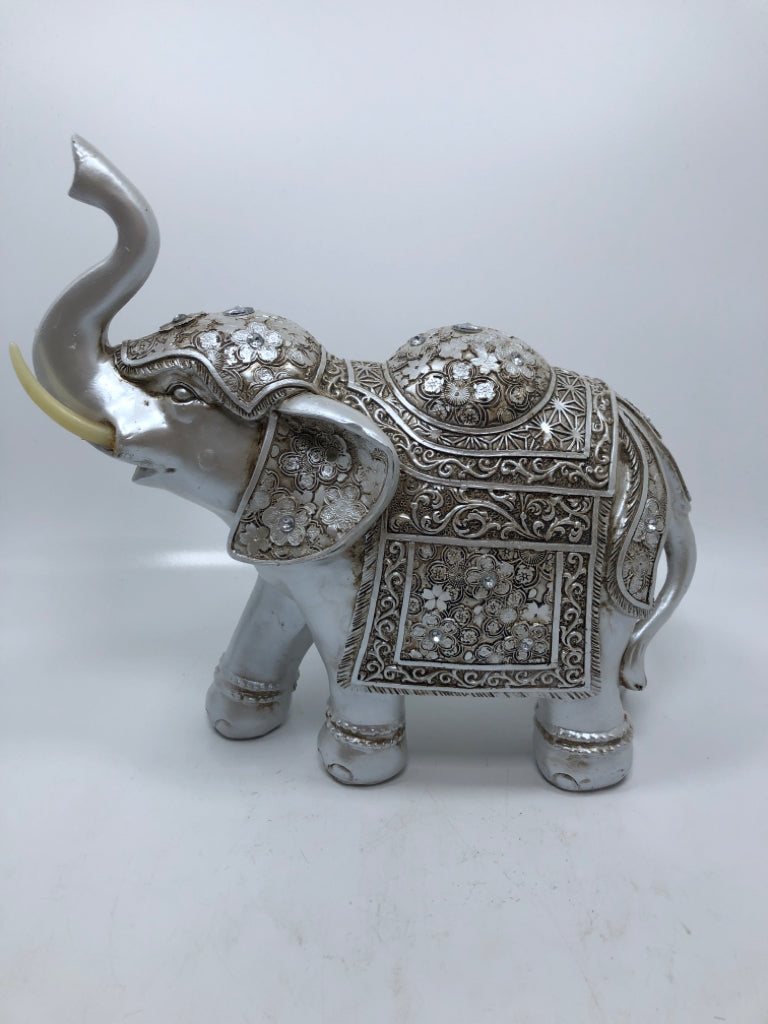 SILVER PAINTED RESIN ELEPHANT.