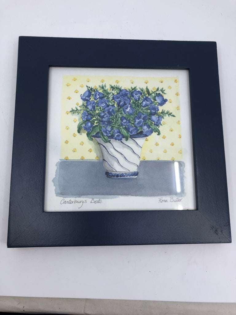 BLUE FLORAL IN YELLOW BACKGROUND IN BLUE FRAME WALL ART.