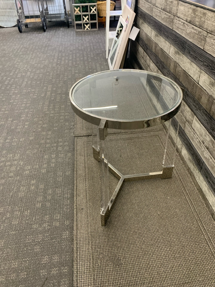 SILVER AND GLASS CIRCLE END TABLE W/ 3 LEGS.