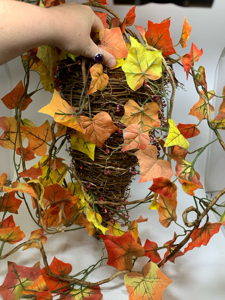 STICK WOVEN HANGING BASKET W/ FAUX FALL LEAVES HANGING.